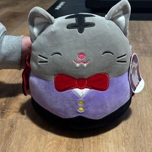 Squishmallows Gray Cat Plush with Red Bow and Purple Vest